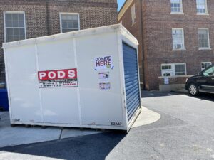 Large donation container located at Bailey Health Center